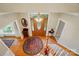 Inviting foyer featuring a wooden front door with stained glass and decorative chandelier above the round rug at 3804 Bellingham Ln, Charlotte, NC 28215