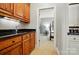 Hallway with oak cabinets leading to Primary bedroom at 3804 Bellingham Ln, Charlotte, NC 28215