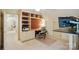 Bright home office with custom built-ins, desk, and comfortable ergonomic chair at 3804 Bellingham Ln, Charlotte, NC 28215