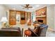 Comfortable living room includes a brick fireplace, wood shelves, and seating area at 3804 Bellingham Ln, Charlotte, NC 28215