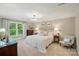 Bright main bedroom with a large window offering natural light and neutral decor that is calming at 3804 Bellingham Ln, Charlotte, NC 28215