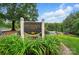 Attractive community sign for Brantley Oaks featuring lush landscaping and amenities, including a pool and playground at 3804 Bellingham Ln, Charlotte, NC 28215