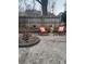 Cozy backyard features patio furniture, a charming fire pit, and a rustic wooden fence at 401 Clover Ln, Newton, NC 28658