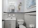 Classic bathroom with monochrome tile, clean fixtures, and a functional layout at 401 Clover Ln, Newton, NC 28658