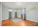 Sunny bedroom with natural light, hardwood floors, and neutral decor at 401 Clover Ln, Newton, NC 28658