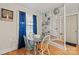 Bright dining area with blue accents, hardwood floors, and built in shelving at 401 Clover Ln, Newton, NC 28658