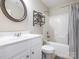 Traditional bathroom featuring a tub-shower, vanity with storage, and neutral decor at 413 River Park Rd, Belmont, NC 28012