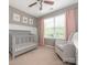 Charming Bedroom featuring a crib, rocker, and soft pink accents, creating a cozy space at 413 River Park Rd, Belmont, NC 28012