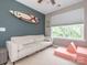 A bedroom featuring a modern sofa and large window at 413 River Park Rd, Belmont, NC 28012
