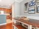 A dining room with hardwood floors and views into the kitchen at 413 River Park Rd, Belmont, NC 28012