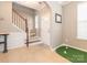 A foyer featuring tiled floors, a staircase, and natural light at 413 River Park Rd, Belmont, NC 28012