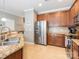 Well-appointed kitchen featuring stainless steel appliances and granite countertops at 413 River Park Rd, Belmont, NC 28012