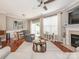 Spacious living room showcasing hardwood floors and seamless flow into the dining area at 413 River Park Rd, Belmont, NC 28012