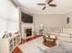 Cozy living room featuring a fireplace, comfortable seating, and plenty of natural light at 413 River Park Rd, Belmont, NC 28012