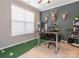 Functional office space with ample natural light, desk setup, and unique decorative elements at 413 River Park Rd, Belmont, NC 28012