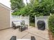 Private back patio with outdoor seating and a grill at 413 River Park Rd, Belmont, NC 28012