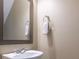 Clean powder room with a modern sink, mirror, and neutral decor at 413 River Park Rd, Belmont, NC 28012