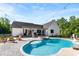 Backyard pool with connected spa, lounge chairs, and a well-manicured lawn at 4453 Buffalo Shoals Rd, Maiden, NC 28650