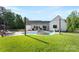 Spacious backyard with pool, lounge chairs, and a grassy area for outdoor activities at 4453 Buffalo Shoals Rd, Maiden, NC 28650