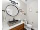 Chic powder room featuring unique stone sink, modern faucet, and stylish decor with a decorative mirror at 4453 Buffalo Shoals Rd, Maiden, NC 28650