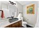 Modern bathroom features a vessel sink, wood cabinets, and black hexagon tile flooring at 4453 Buffalo Shoals Rd, Maiden, NC 28650