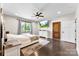 Comfortable bedroom featuring neutral tones, a ceiling fan, and a large window providing ample natural light at 4453 Buffalo Shoals Rd, Maiden, NC 28650