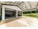 View of the large detached garage with an open covered area and plenty of space for equipment and tools at 4453 Buffalo Shoals Rd, Maiden, NC 28650