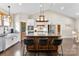 Stylish kitchen boasts a large island, modern appliances, and a convenient breakfast bar with three chairs at 4453 Buffalo Shoals Rd, Maiden, NC 28650
