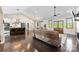 Spacious living room with hardwood floors, vaulted ceilings, and an open layout connecting to the kitchen and dining area at 4453 Buffalo Shoals Rd, Maiden, NC 28650