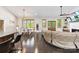 Open-concept living area with hardwood floors, a dining table, and a comfortable seating area, perfect for entertaining at 4453 Buffalo Shoals Rd, Maiden, NC 28650