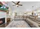 Open-concept living space with hardwood floors, fireplace, TV, and large sectional sofa, ideal for relaxing and entertaining at 4453 Buffalo Shoals Rd, Maiden, NC 28650