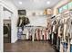 Spacious walk-in closet featuring custom shelving, hanging rods, and dark hardwood floors at 4453 Buffalo Shoals Rd, Maiden, NC 28650