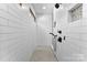 Bright walk-in shower featuring white subway tile, mosaic tile floor, and black shower fixtures at 4453 Buffalo Shoals Rd, Maiden, NC 28650
