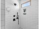 Modern tiled walk-in shower with black fixtures and a built-in shelving niche at 4453 Buffalo Shoals Rd, Maiden, NC 28650