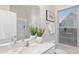 Bright bathroom featuring a large mirror, single sink vanity, and window at 448 Berryman Rd, Rock Hill, SC 29732