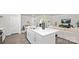 Bright, open-concept kitchen with a large island, stainless steel sink, and modern finishes at 448 Berryman Rd, Rock Hill, SC 29732