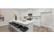 Modern kitchen with white cabinets, stainless steel appliances, and a large island with seating at 448 Berryman Rd, Rock Hill, SC 29732