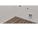 Minimalist laundry room with hardwood floors and white walls at 448 Berryman Rd, Rock Hill, SC 29732