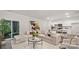 Bright, modern living room with a large sectional sofa and open floor plan to the kitchen at 448 Berryman Rd, Rock Hill, SC 29732