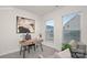 Cozy office space featuring a modern desk, stylish chair, and natural light from two windows at 448 Berryman Rd, Rock Hill, SC 29732