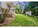 Spacious backyard highlighting a deck, shed, and mature trees, ideal for outdoor living at 4501 Bainview Dr, Mint Hill, NC 28227