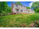 Exterior view of home showcasing a spacious backyard and deck at 4501 Bainview Dr, Mint Hill, NC 28227