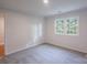 Well-lit bedroom with plush carpeting, and a window with calming views of the outdoors at 4501 Bainview Dr, Mint Hill, NC 28227