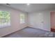 Inviting bedroom with plush carpeting, and two windows allowing ample natural light to enter at 4501 Bainview Dr, Mint Hill, NC 28227