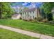 Two-story home with attached garage, landscaped yard, and inviting curb appeal at 4501 Bainview Dr, Mint Hill, NC 28227