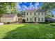 Charming two-story home with an attached two-car garage and a lush green front lawn at 4501 Bainview Dr, Mint Hill, NC 28227