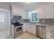 Updated kitchen with granite countertops, stainless steel appliances, and a window over the sink at 4501 Bainview Dr, Mint Hill, NC 28227