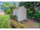 Cozy backyard shed nestled among lush greenery and a charming fence at 4501 Bainview Dr, Mint Hill, NC 28227