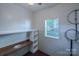 Storage room with shelves, work surface and peg board at 4501 Bainview Dr, Mint Hill, NC 28227