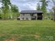 Large backyard with a house featuring a deck with outdoor seating perfect for entertaining at 4561 N Wynswept N Dr, Maiden, NC 28650
